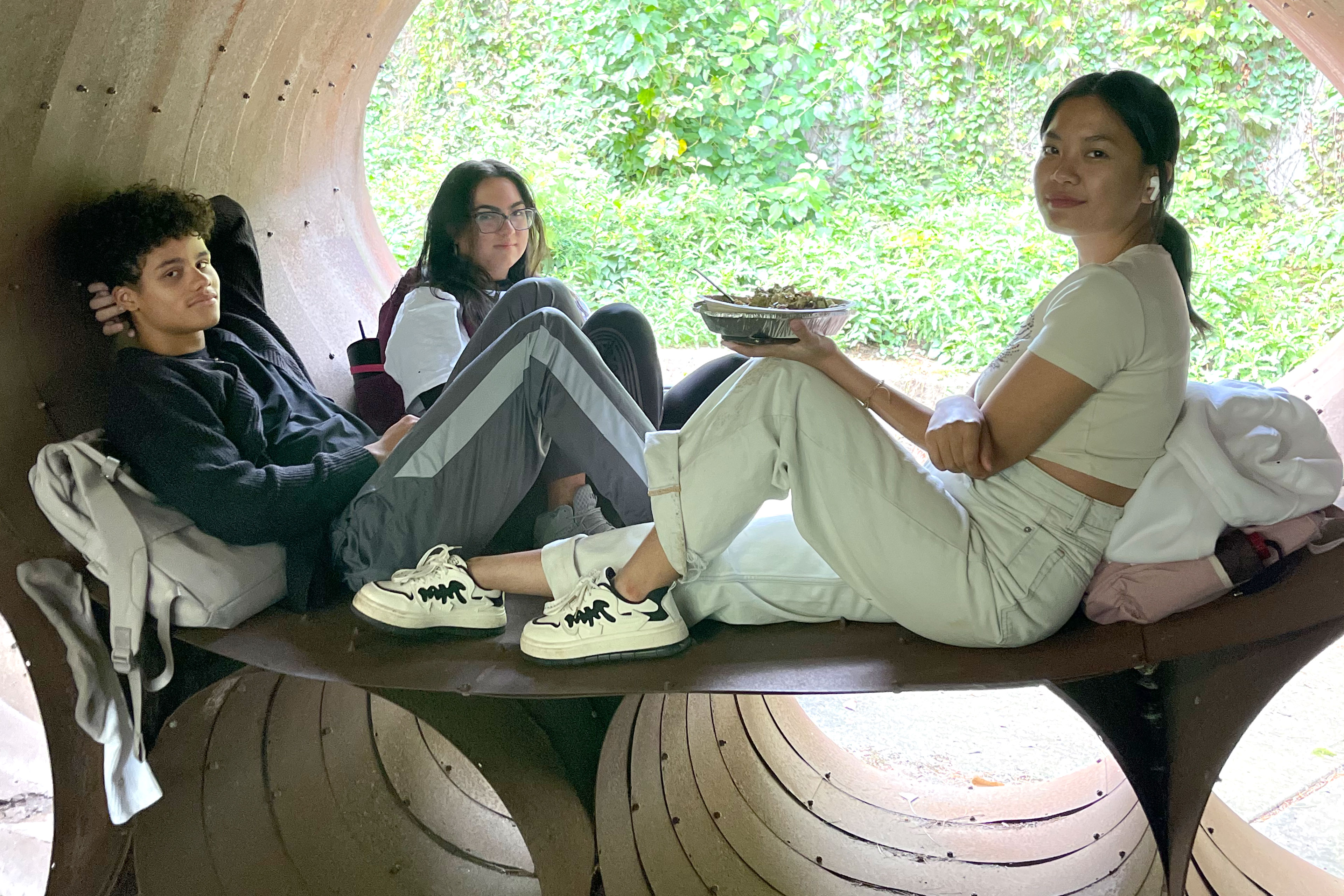 Students sitting inside a circular structure