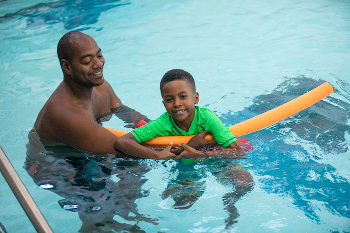 Lehman Summer Camp male student and instructor in pool