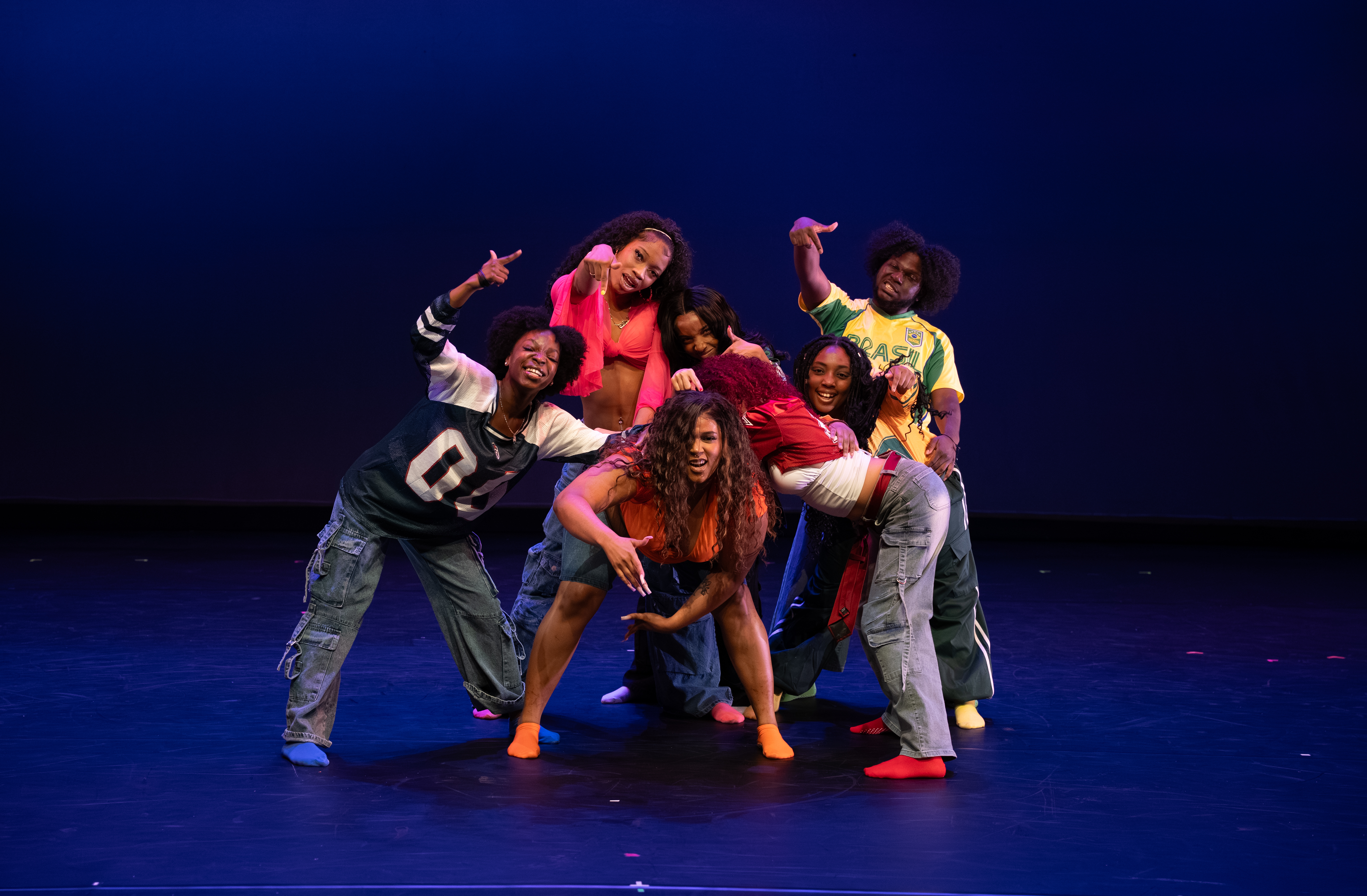 Students posing on stage