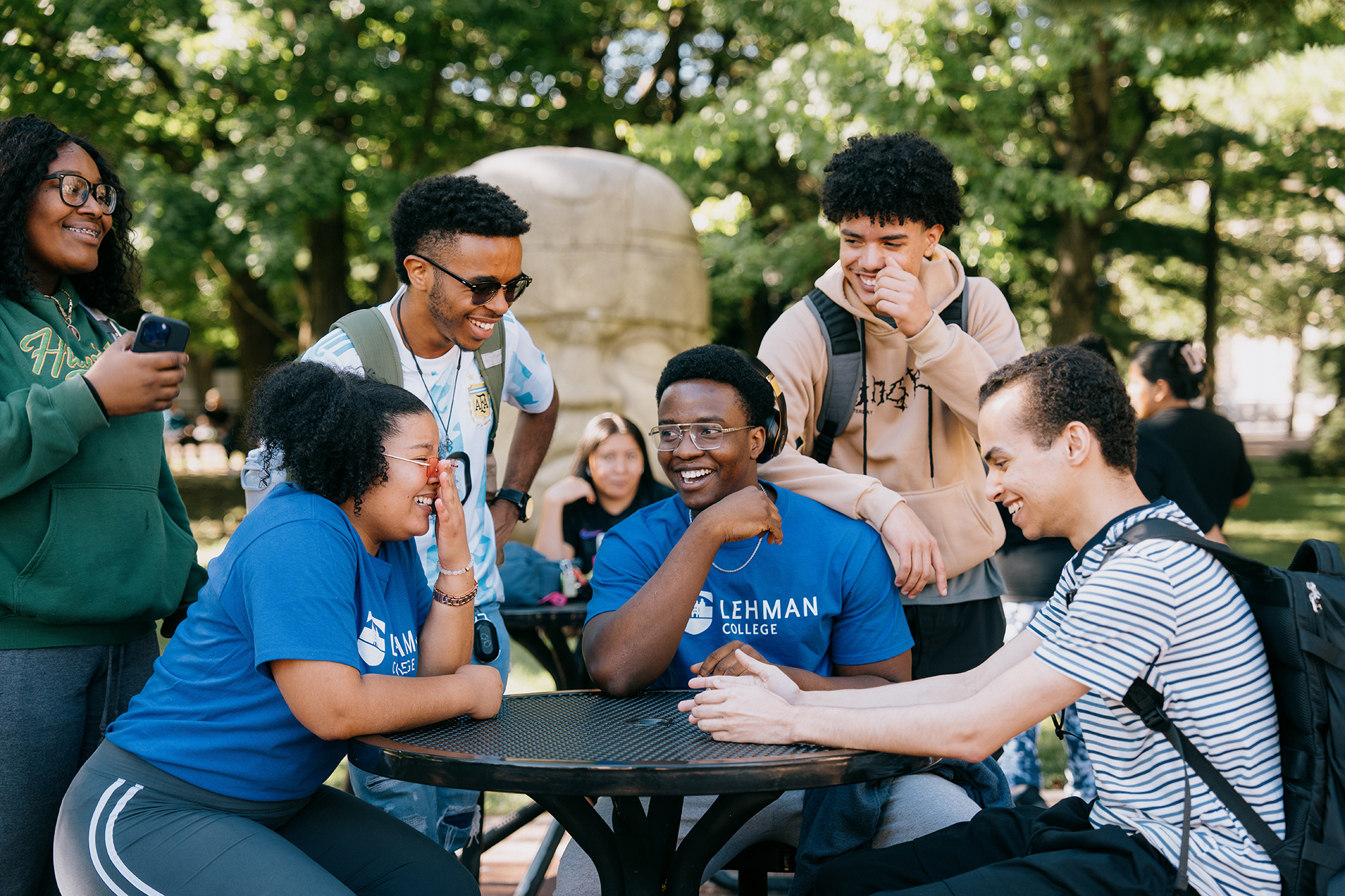 Photo of students sitting at a table