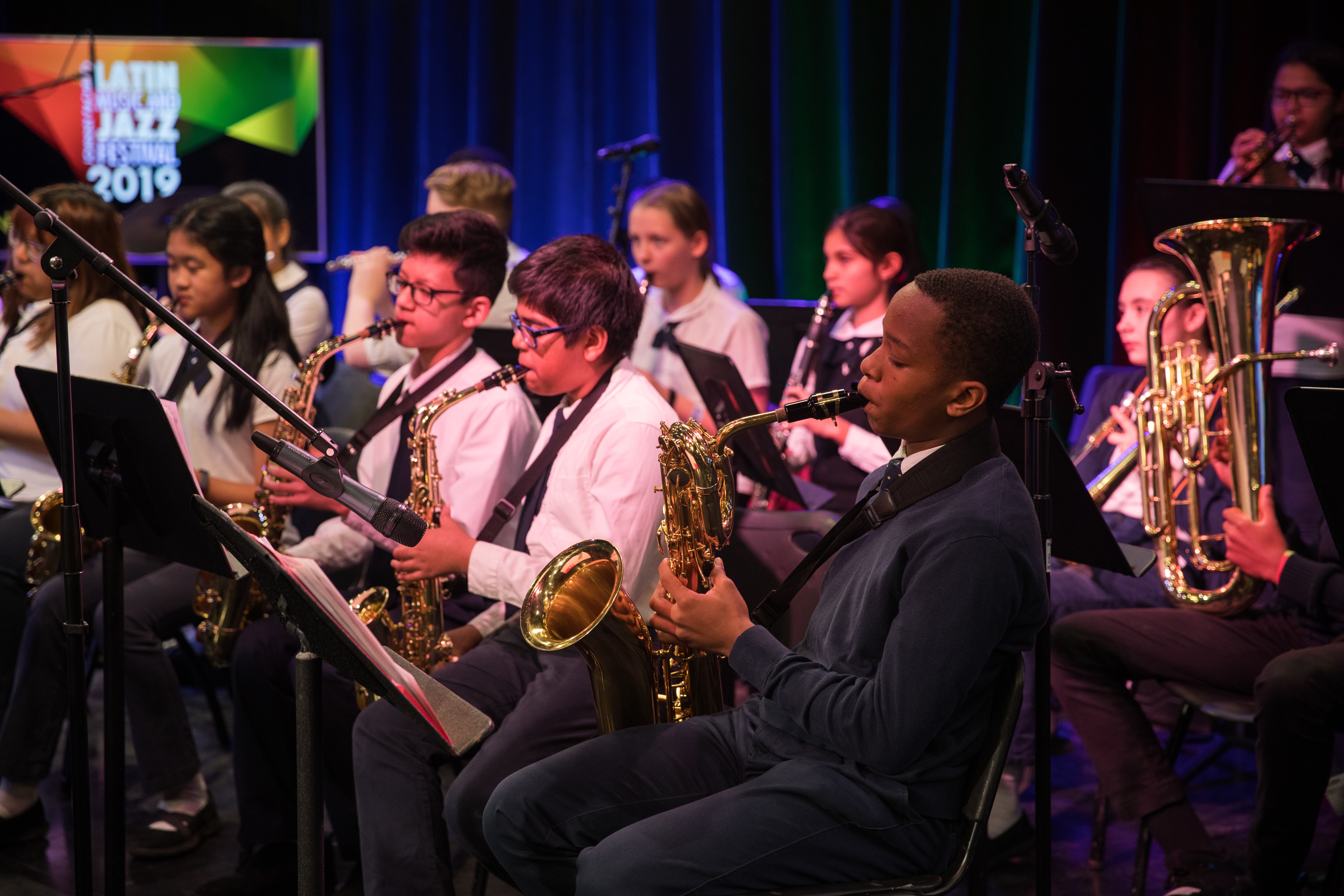 Children  in a band playing saxophones