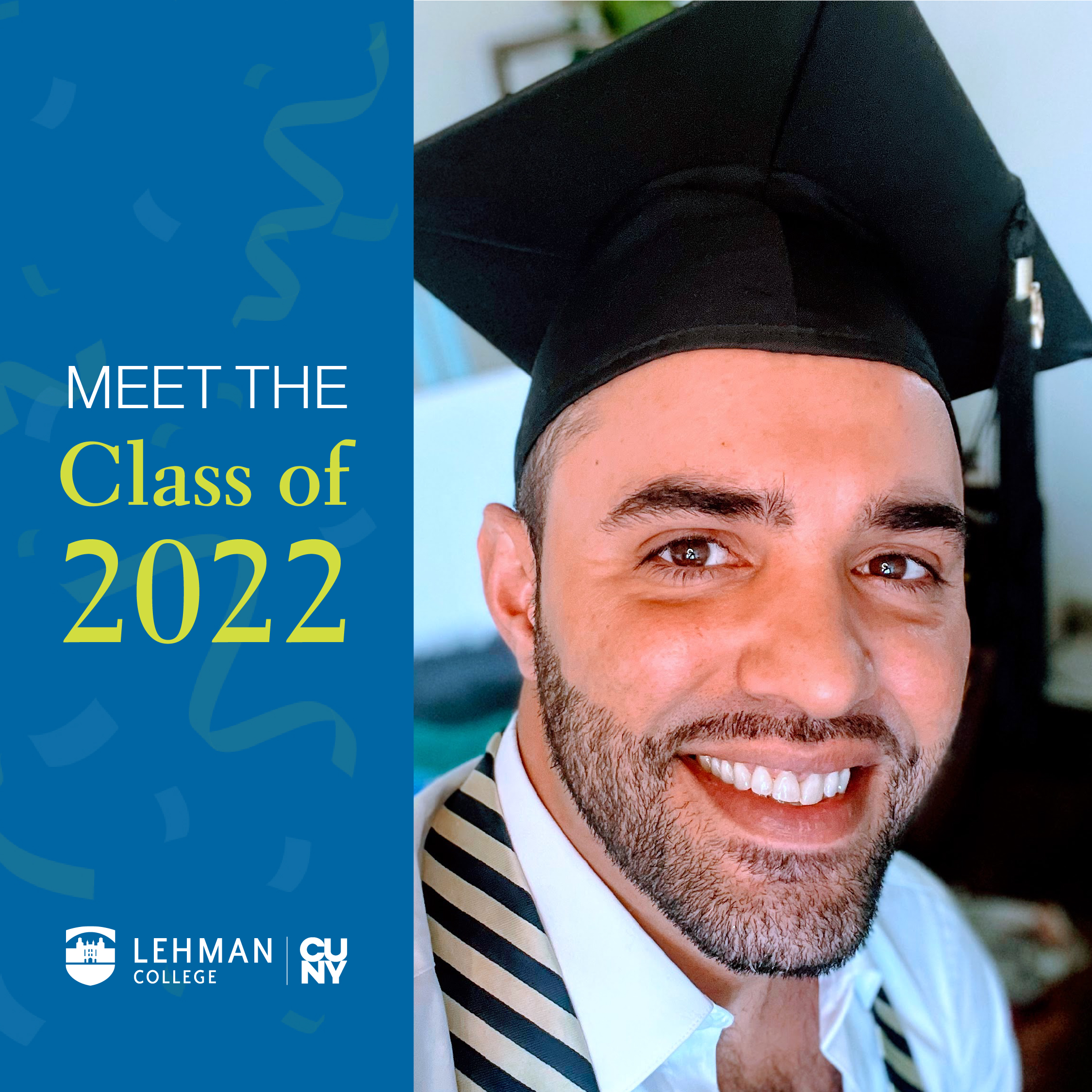 A Latino man wearing a mortarboard smiles at the camera