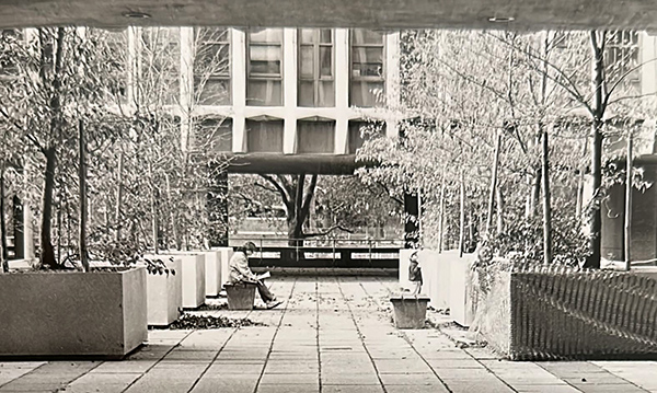 A look at Carman Hall with the ground four open and on pillars.