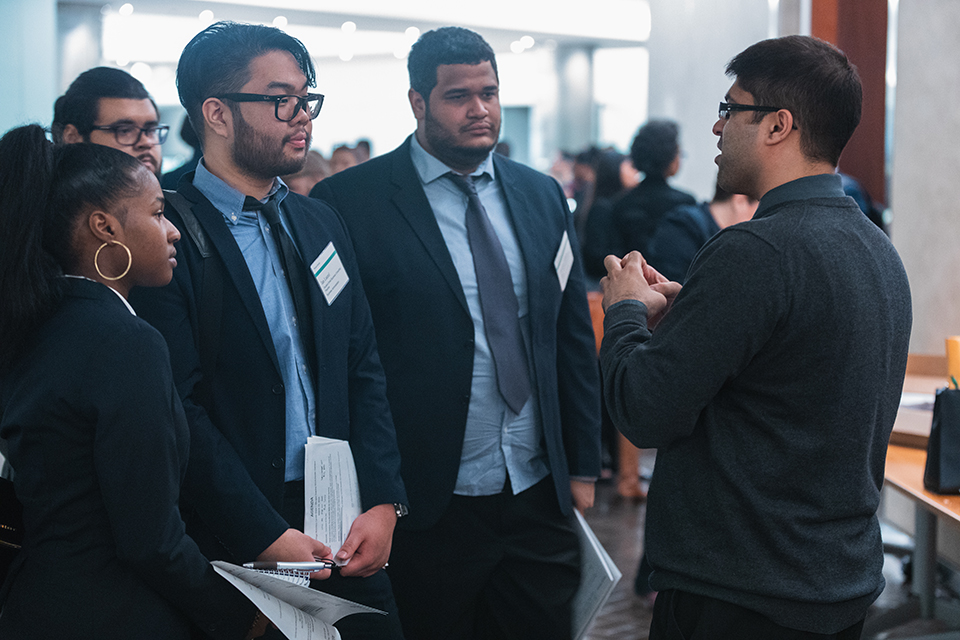 Lehman students meet with employers at a career expo.