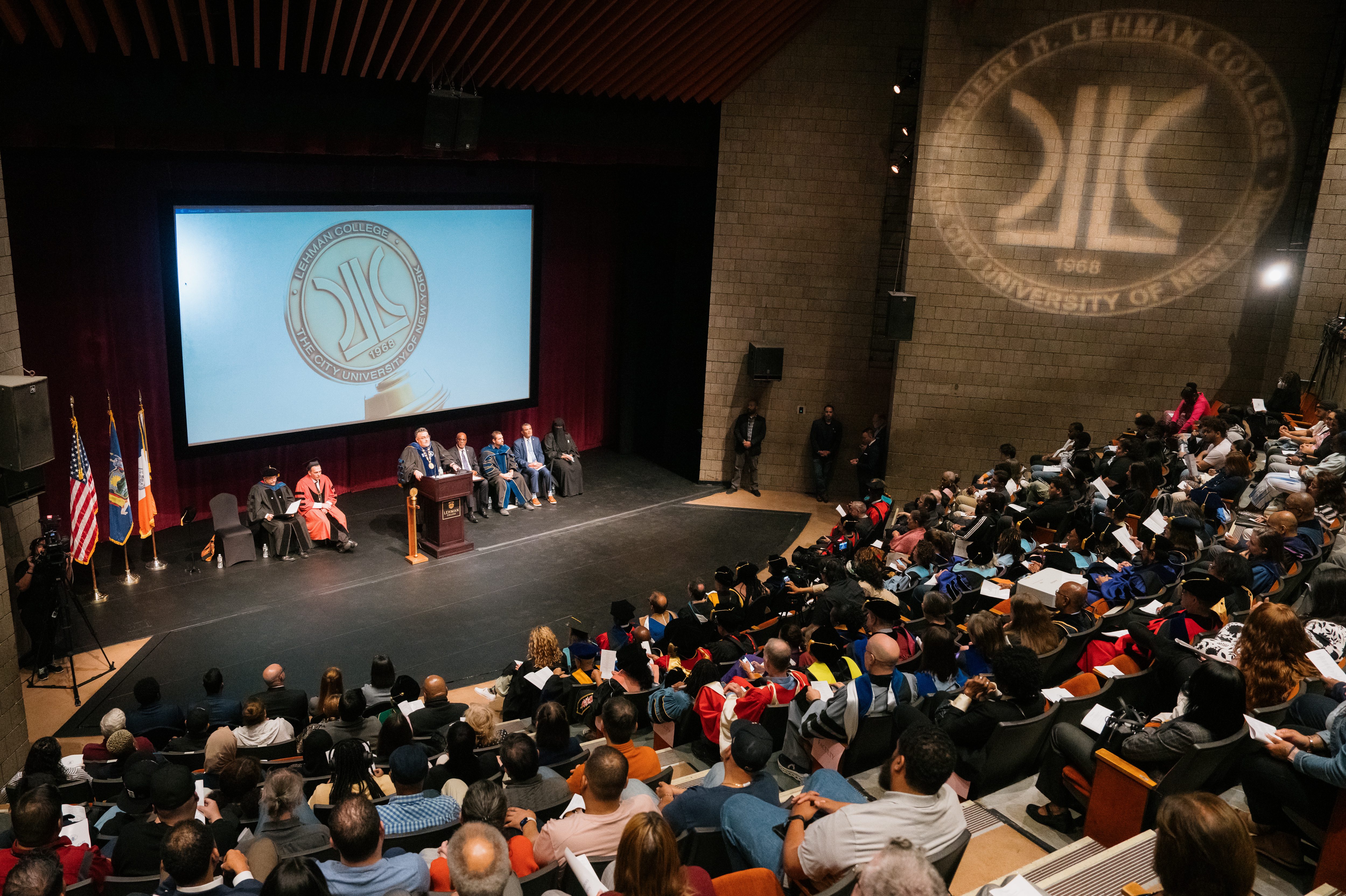 A group of students in a theatre celebrating the new semester