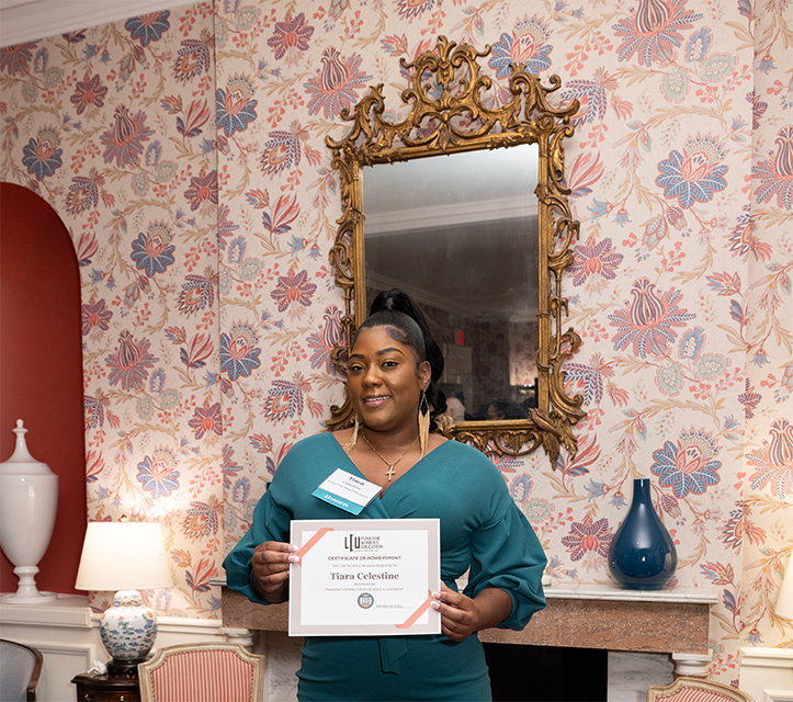 Tiara Celestine poses with her award.