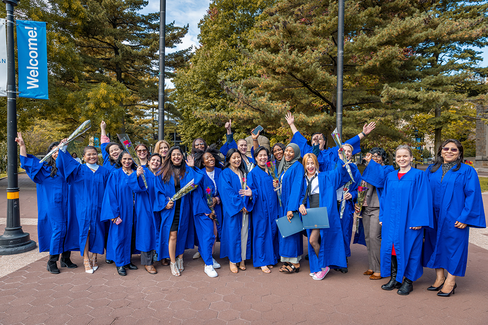 Recent graduates of the program celebrate their achievement.