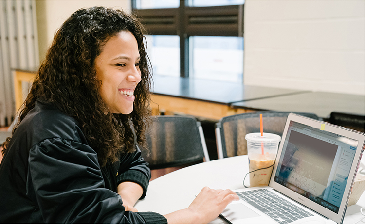 Woman smiling with her laptop