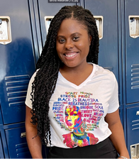 Student smiling in front blue lockers