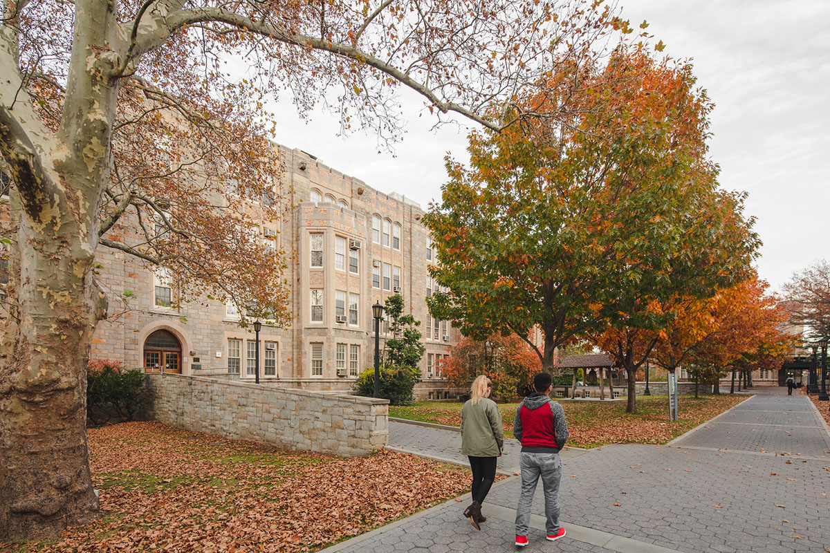 Photo of students walking by Gillet Hall Building