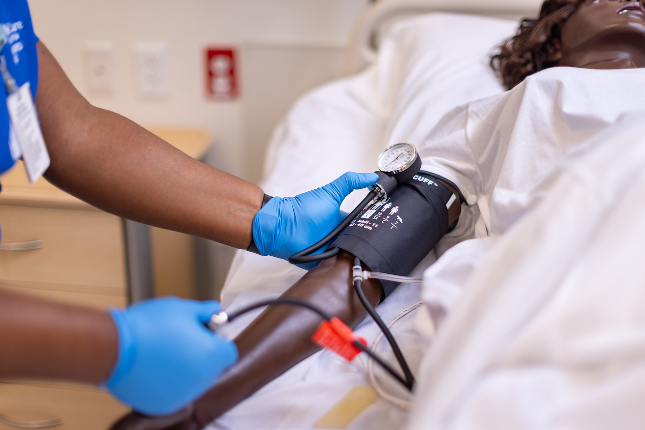 Nurse using stethoscope